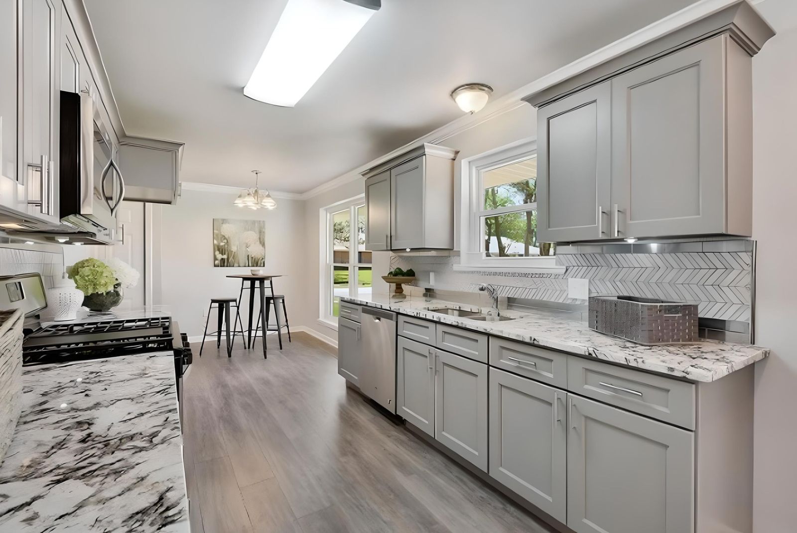 Kitchen with S1 Ash Grey shaker cabinets and marble-look quartz counters
