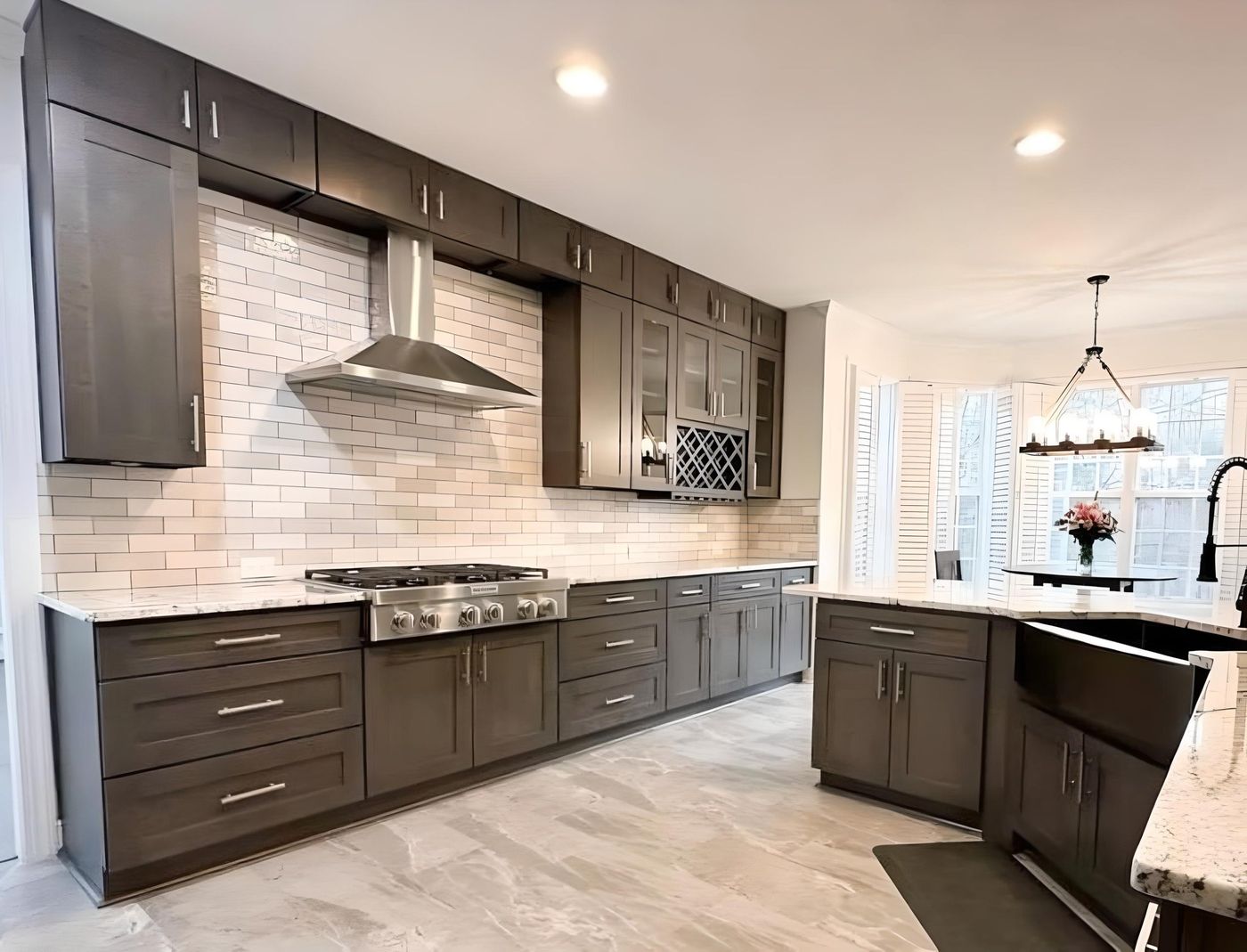 Kitchen with S1 Ash Grey wood-grain cabinets, stainless range hood and black sink