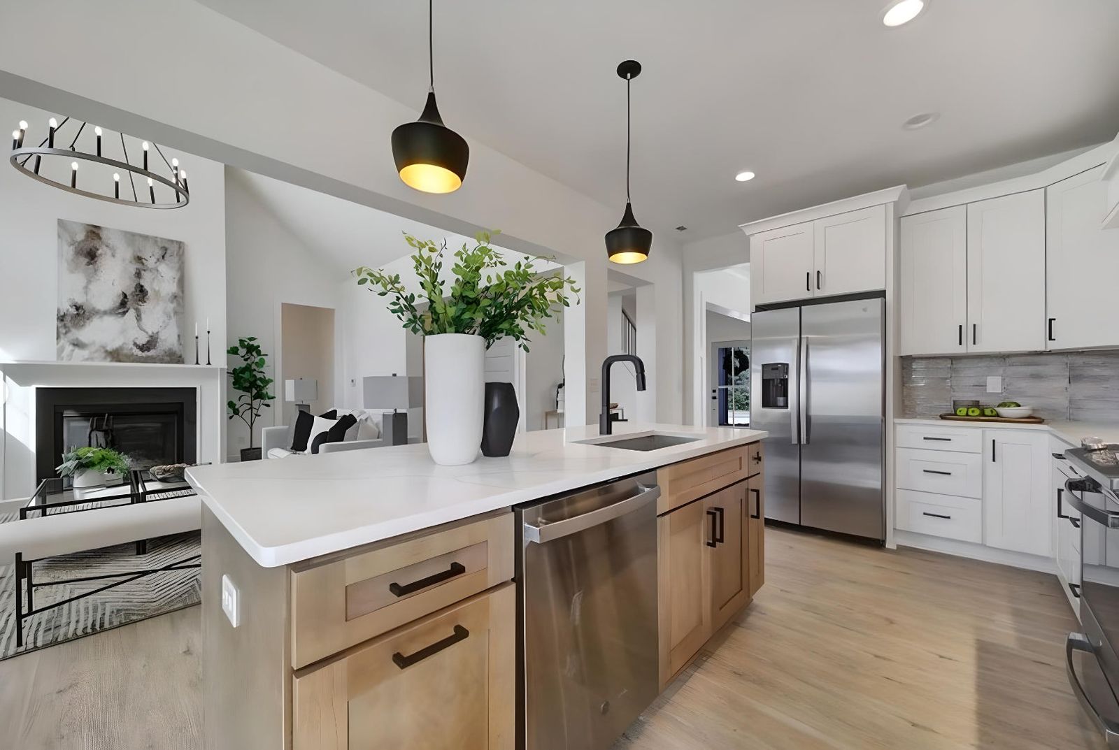 Kitchen with white shaker uppers and S2 Honey wood island, black pendants