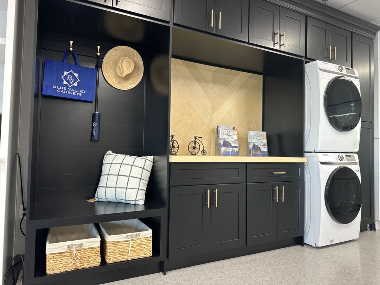 Mudroom with D8 Black Swan shaker cabinets, stacked washer and dryer and built-in bench